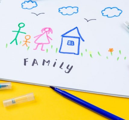 Home, love, family, still life concept. felt-tip pen lying on a paper with children's drawing family. Selective focus, copy space background